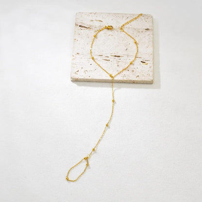 Elegant Gold-Tone Hand Chain Bracelet with Ring Chain